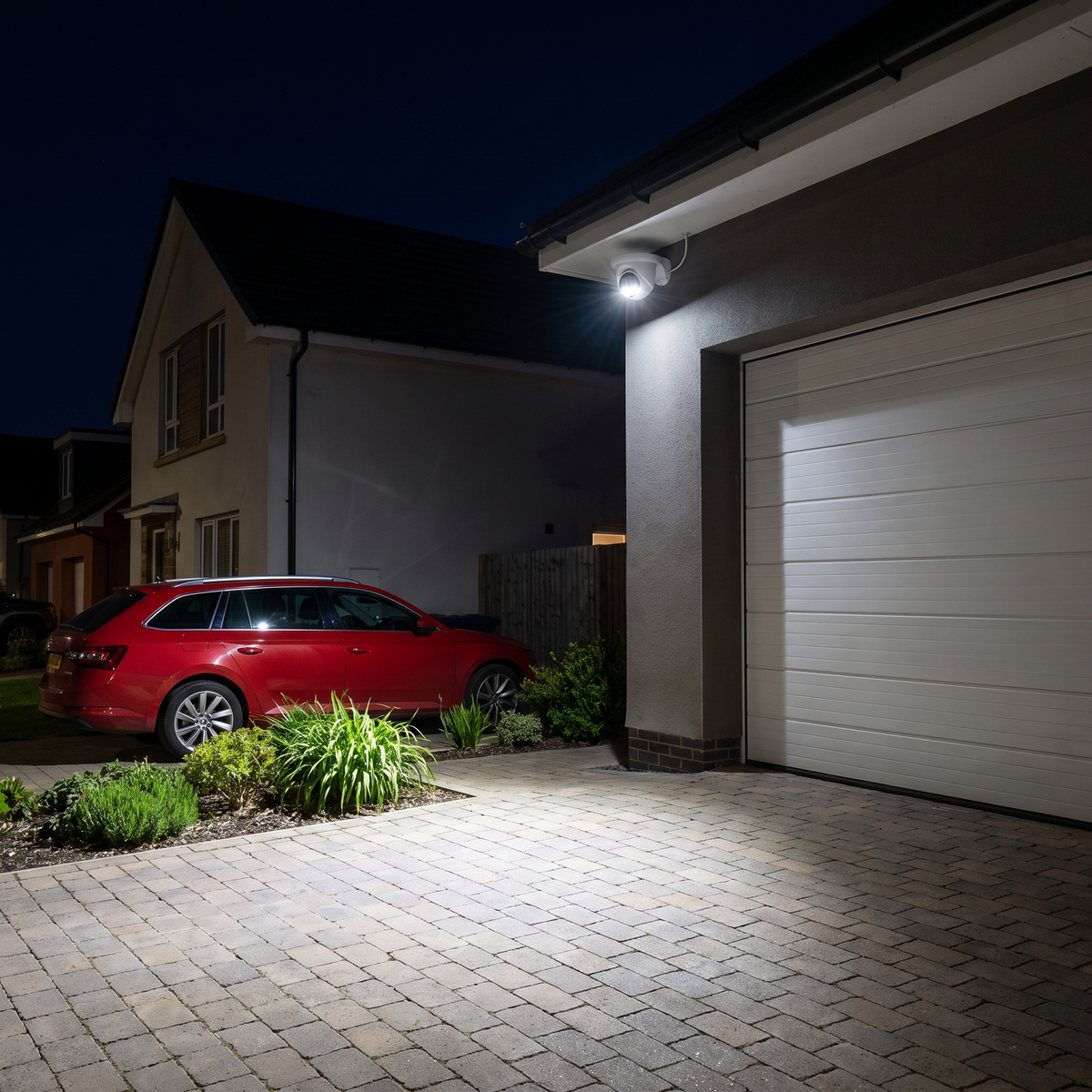 A driveway lit in full colour at night by the camera's white LEDs