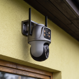 The camera with its lower pan-tilt head turned away from the fixed upper lens